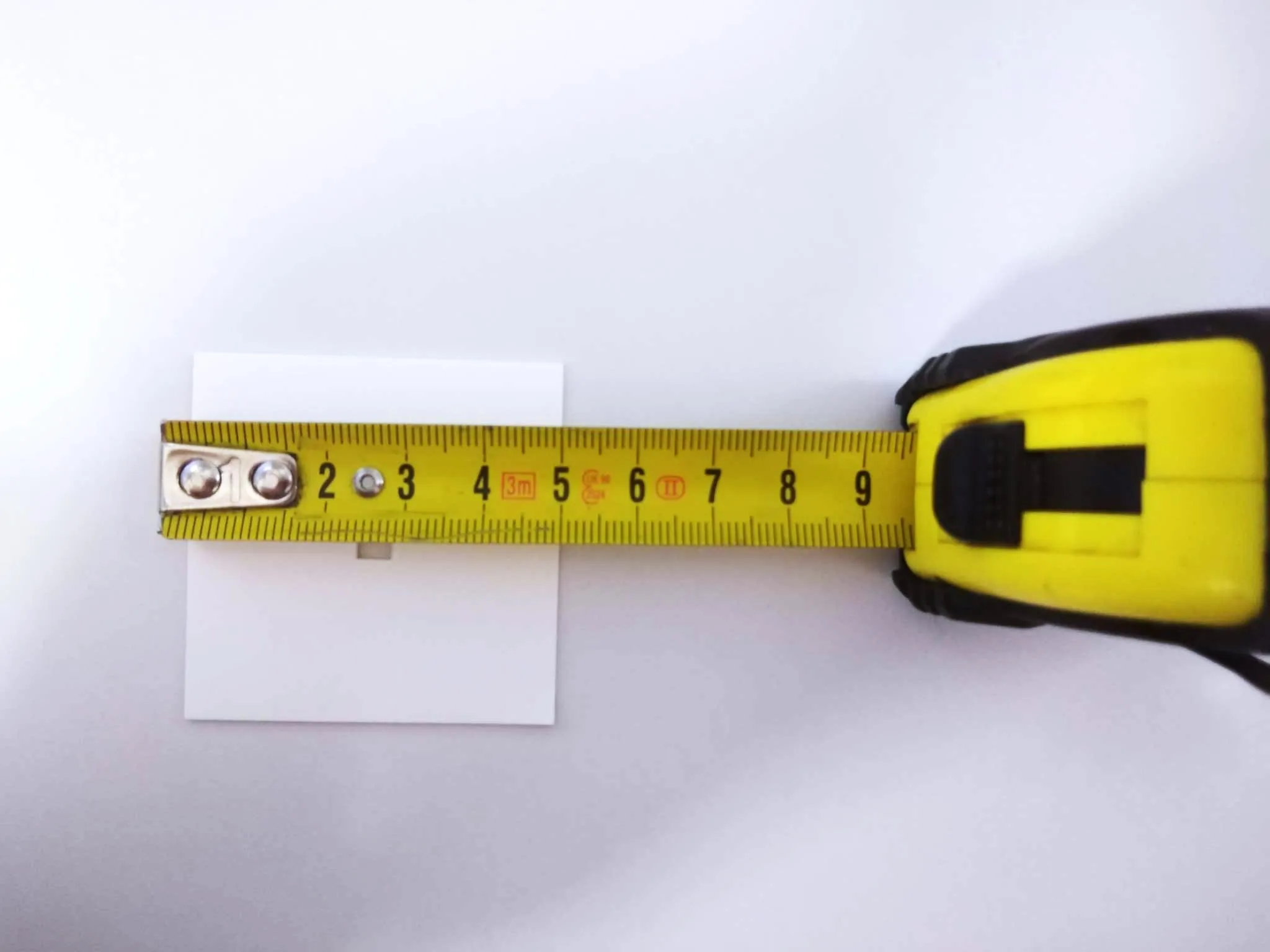 IRRAD Cardboard Holder with a 5x5 mm cutout in the center.